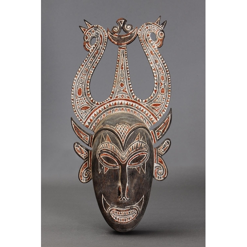 1126 - HUON GULF MASK, TAMI ISLANDS. Carved and engraved hardwood with natural pigments. Approx L50.5 x 24c... 