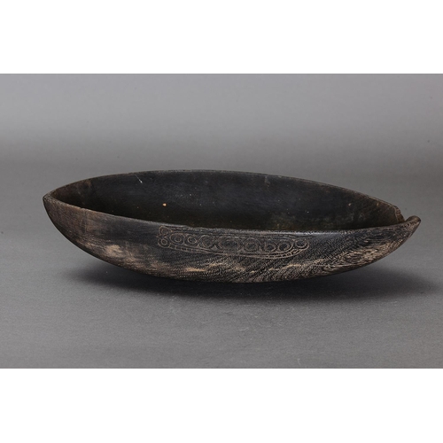 1127 - EARLY HUON GULF FOOD BOWL, TAMI ISLANDS. Carved and engraved hardwood. Approx L39.5 x 21cm. PROVENAN... 