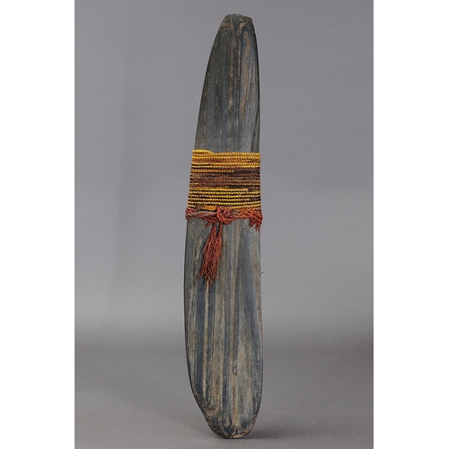 1128 - LARGE DANI JE STONE, IRIAN JAYA. Carved stone and attached with plant fibers. Je stone is used as an... 