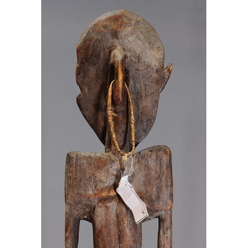 1130 - LARGE IATMUL SUSPENSION HOOK FIGURE, MIDDLE SEPIK RIVER, PAPUA NEW GUINEA. Carved and engraved hardw... 