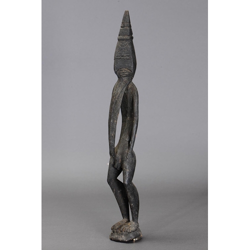 1132 - LARGE SEPIK FIGURE, PAPUA NEW GUINEA. Carved and engraved wood. Approx L63 x 10cm. PROVENANCE Ex Ech... 