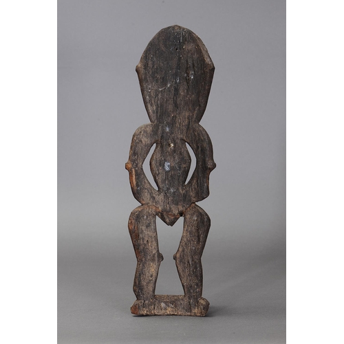 1133 - ANCESTRAL FIGURE, BLACKWATER RIVER, PAPUA NEW GUINEA. Carved and engraved hardwood in the form of an... 