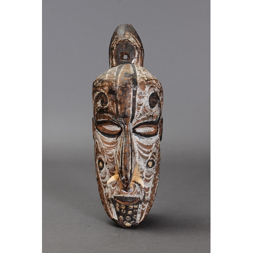 1135 - IATMUL ANCESTOR HEAD, PAPUA NEW GUINEA. Carved and engraved hardwood with natural pigments. Approx L... 