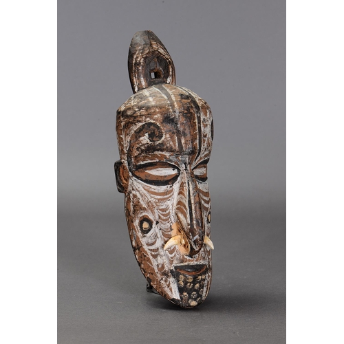 1135 - IATMUL ANCESTOR HEAD, PAPUA NEW GUINEA. Carved and engraved hardwood with natural pigments. Approx L... 