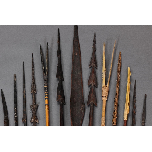 1148 - COLLECTION OF THIRTEEN EARLY MELANESIAN SPEARS. Carved and engraved wood, bone, bamboo, with natural... 