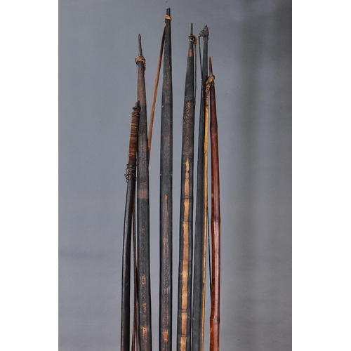 1149 - A COLLECTION OF SIX EARLY BOWS, PAPUA NEW GUINEA. Carved and engraved hardwood and plant fibers. App... 