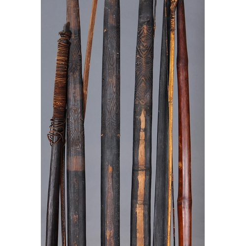 1149 - A COLLECTION OF SIX EARLY BOWS, PAPUA NEW GUINEA. Carved and engraved hardwood and plant fibers. App... 