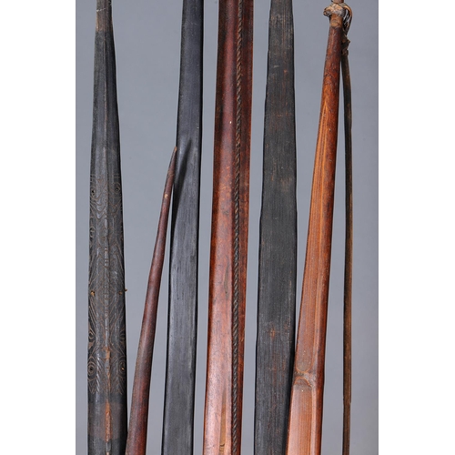 1150 - A COLLECTION OF SIX EARLY BOWS, PAPUA NEW GUINEA. Carved and engraved hardwood and plant fibers. App... 