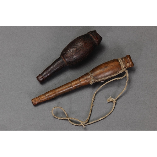 1151 - PAIR OF EARLY EAST TIMOR WHISTLES. Carved and engraved hardwood with natural fibre. Approx Lengths 1... 