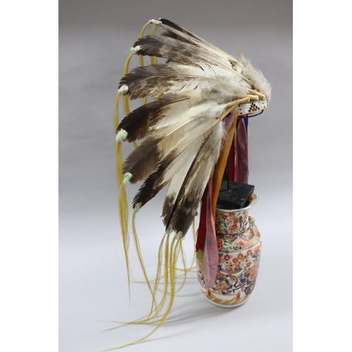 1185 - Magnificent rare Plains Indian single-trail headdress. Constructed with felt cap, front band of glas... 