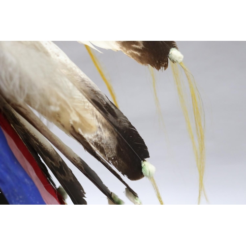 1185 - Magnificent rare Plains Indian single-trail headdress. Constructed with felt cap, front band of glas... 