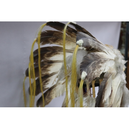 1185 - Magnificent rare Plains Indian single-trail headdress. Constructed with felt cap, front band of glas... 