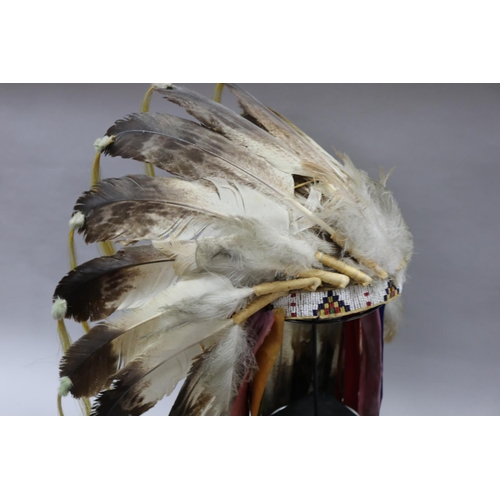 1185 - Magnificent rare Plains Indian single-trail headdress. Constructed with felt cap, front band of glas... 