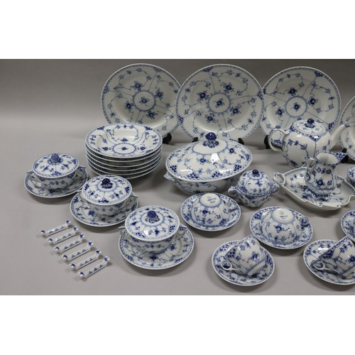 92 - Extensive Royal Copenhagen service. Blue fluted lace pattern, teapot has been repaired to lip, two l... 