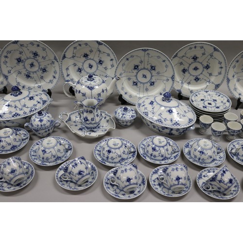 92 - Extensive Royal Copenhagen service. Blue fluted lace pattern, teapot has been repaired to lip, two l... 