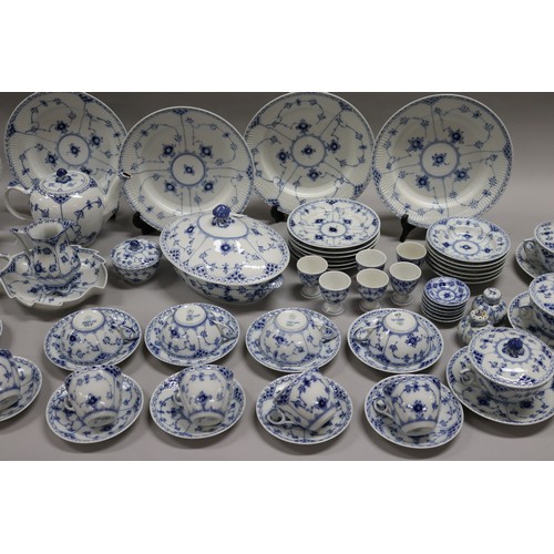 92 - Extensive Royal Copenhagen service. Blue fluted lace pattern, teapot has been repaired to lip, two l... 