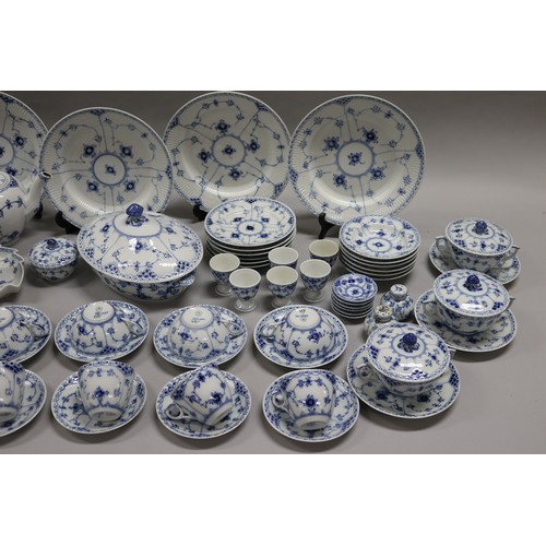 92 - Extensive Royal Copenhagen service. Blue fluted lace pattern, teapot has been repaired to lip, two l... 