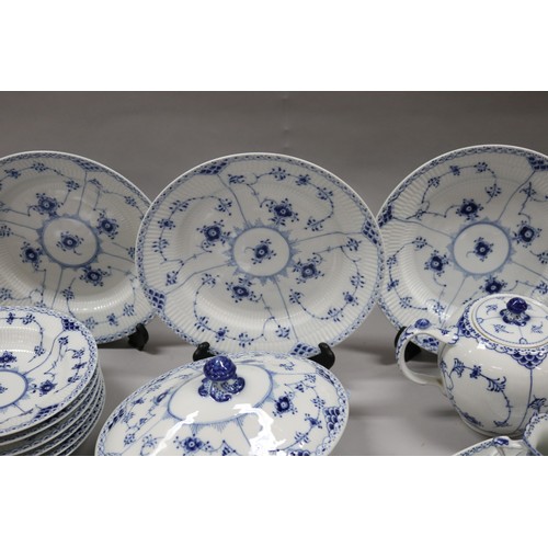 92 - Extensive Royal Copenhagen service. Blue fluted lace pattern, teapot has been repaired to lip, two l... 