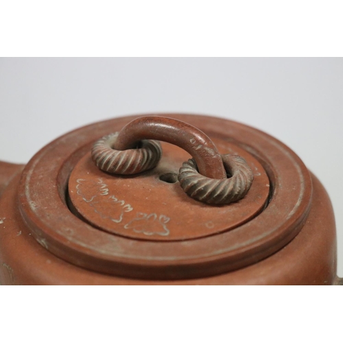 71 - Antique Chinese Yixing terracotta tea pot, of plain cylinder form, loop cover handle with two rope t... 