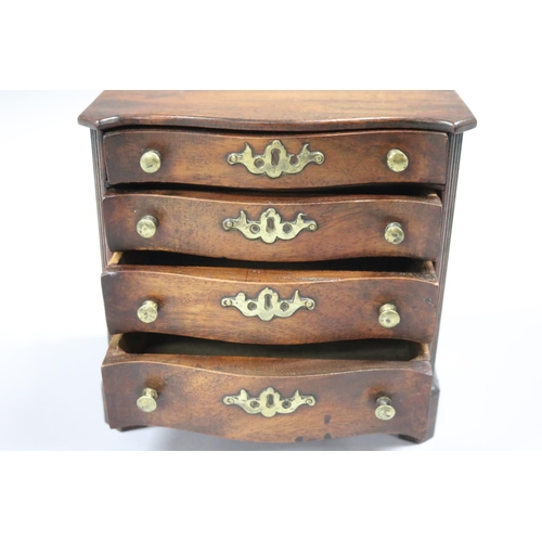 66 - Rare antique miniature Chippendale design serpentine front chest of four graduating size, with brass... 