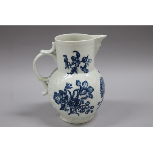 81 - Antique Worcester cabbage leaf mask head jug, under glaze blue flower pattern, double C scroll handl... 