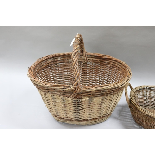 3021 - Two vintage French woven baskets, approx 28cm H ex handle x 52cm W x 41cm D and smaller (2)