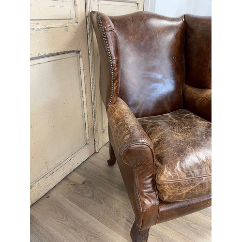 97 - Georgian style brown leather wing arm chair