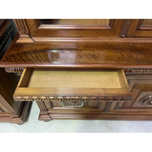 103 - Pair of French walnut two height bookcases, each with a carved in high relief female mask central ca... 