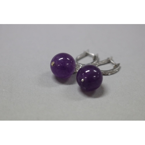 177 - Diamond and amethyst drop earrings set in 18ct white gold