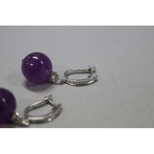 177 - Diamond and amethyst drop earrings set in 18ct white gold