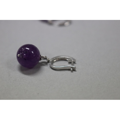 177 - Diamond and amethyst drop earrings set in 18ct white gold