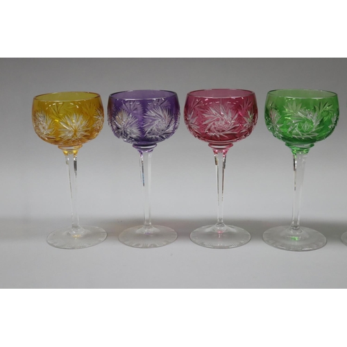 82 - Two sets of four coloured flashed cut crystal hock/wine glass, facetted stems and cut bases, 2 x 4 s... 