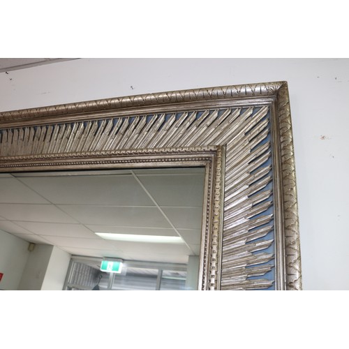 138 - Large decorative silvered wood mirror, with star burst silvered inner frame on a blue ground, approx... 