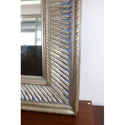 138 - Large decorative silvered wood mirror, with star burst silvered inner frame on a blue ground, approx... 