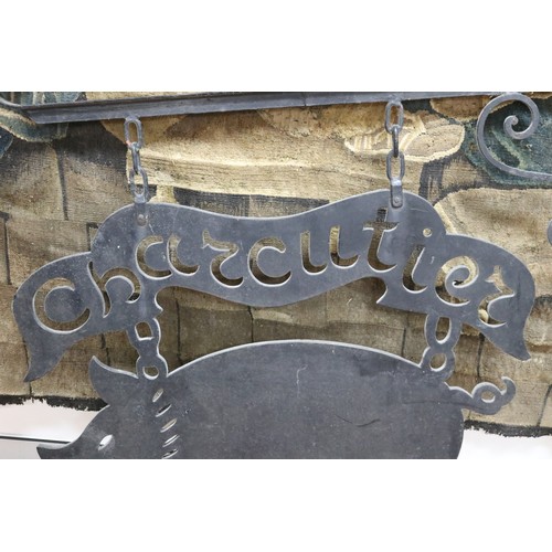 113 - Vintage French pig Charcutier sign, in the form of a cut out wooden pig and cartouche, held by a iro... 