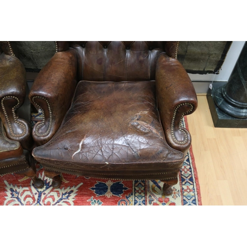 84 - Pair of vintage Georgian revival studded brown leather wing arm chairs, cushions distressed conditio... 