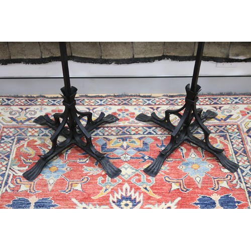 100 - Large pair of wrought iron gothic revival nine stick floor standing pickets, each of two tiered desi... 