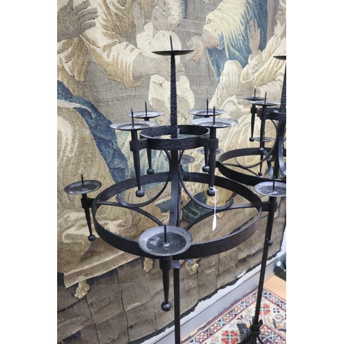 100 - Large pair of wrought iron gothic revival nine stick floor standing pickets, each of two tiered desi... 