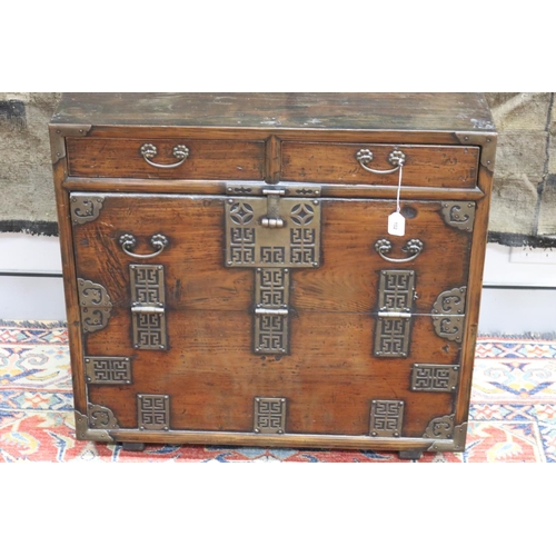 102 - Antique Japanese pierced brass mounted tansu cabinet, carry handles to the sides. Drop flap front be... 