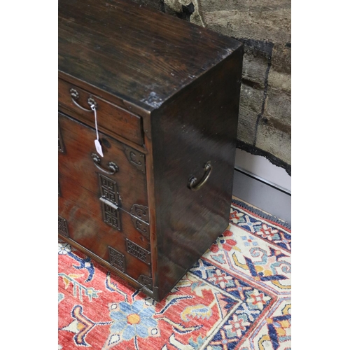 102 - Antique Japanese pierced brass mounted tansu cabinet, carry handles to the sides. Drop flap front be... 