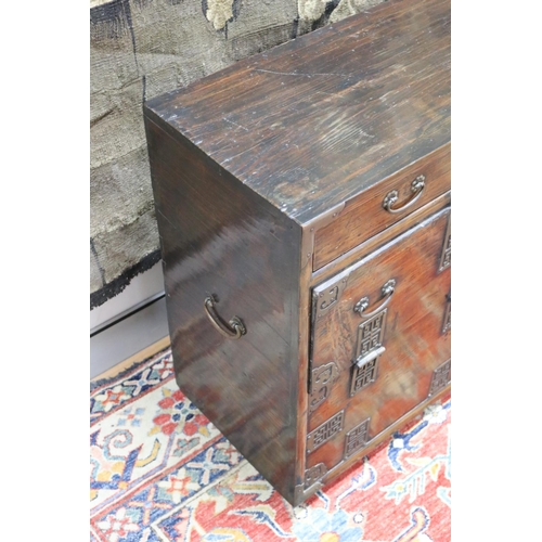 102 - Antique Japanese pierced brass mounted tansu cabinet, carry handles to the sides. Drop flap front be... 