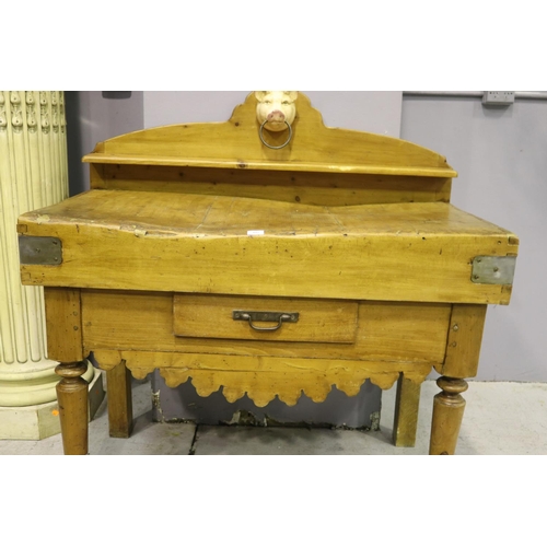 112 - Antique French wooden chopping block table, with later painted iron pigs head mount, having backboar... 