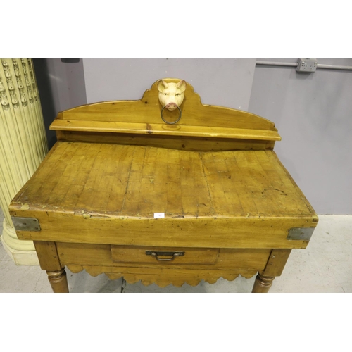 112 - Antique French wooden chopping block table, with later painted iron pigs head mount, having backboar... 