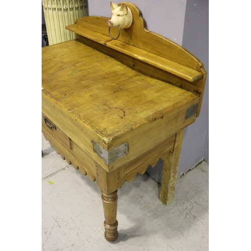 112 - Antique French wooden chopping block table, with later painted iron pigs head mount, having backboar... 