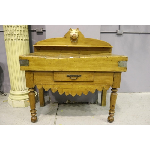 112 - Antique French wooden chopping block table, with later painted iron pigs head mount, having backboar... 