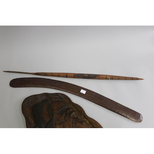 3210 - Old hardwood Aboriginal boomerang along with a spear head, carved Aboriginal head profile panel (3)
