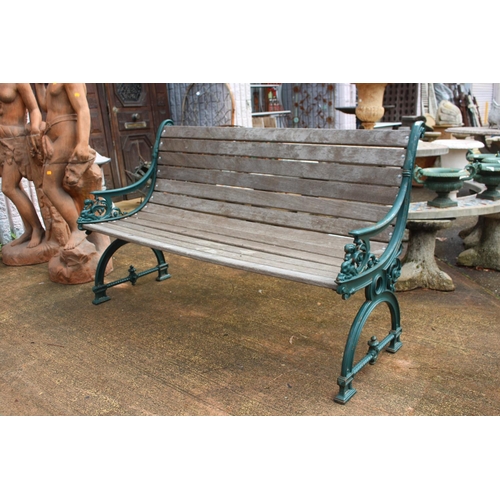 1047 - Garden bench with cast iron ends & wooden slats, approx 149cm W
