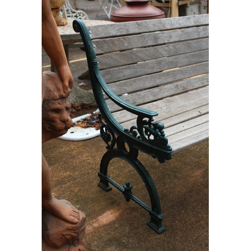 1047 - Garden bench with cast iron ends & wooden slats, approx 149cm W