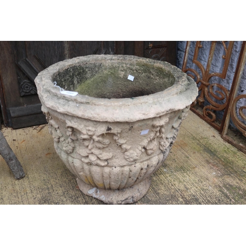 1052 - Composite stone circular pot / planter with decoration, approx 42cm H x 50cm Dia