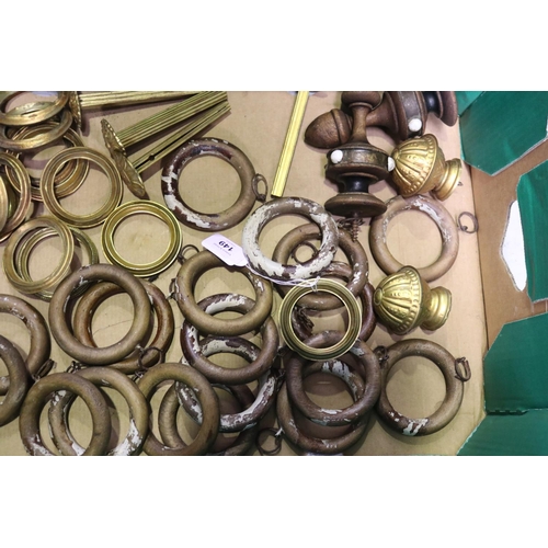 149 - Large quantity of 19th century gilt brass curtain tie backs, rings and rod finial together with a qu... 